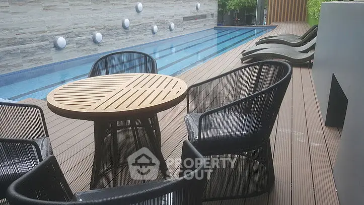 Luxurious poolside area with modern seating and sleek design