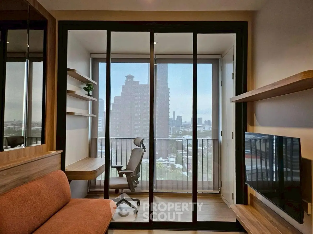 Modern apartment with city view, featuring a cozy living area and stylish furniture.