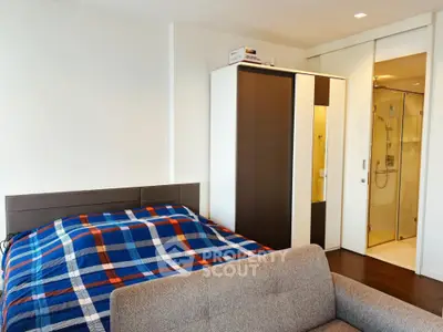 Modern bedroom with ensuite bathroom and stylish furniture