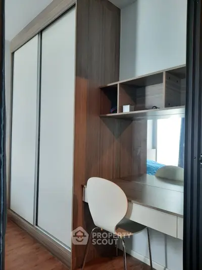 Modern bedroom with sleek wardrobe and study desk