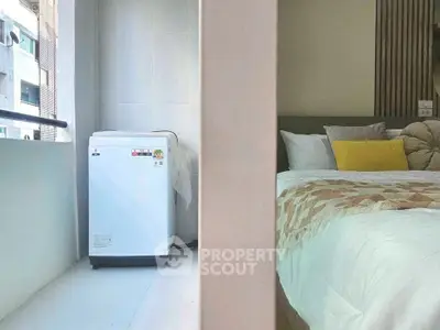 Cozy bedroom with modern washing machine on balcony, perfect for urban living.