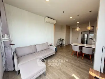 Modern living room with open kitchen and stylish decor