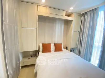 Modern bedroom with built-in storage and cozy lighting