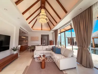 Luxurious living room with vaulted ceiling and elegant chandelier in a modern villa