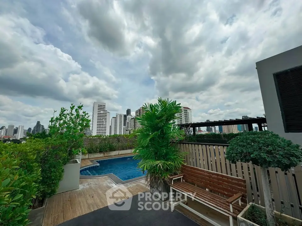 Stunning rooftop pool with city skyline views, perfect for relaxation and entertainment.