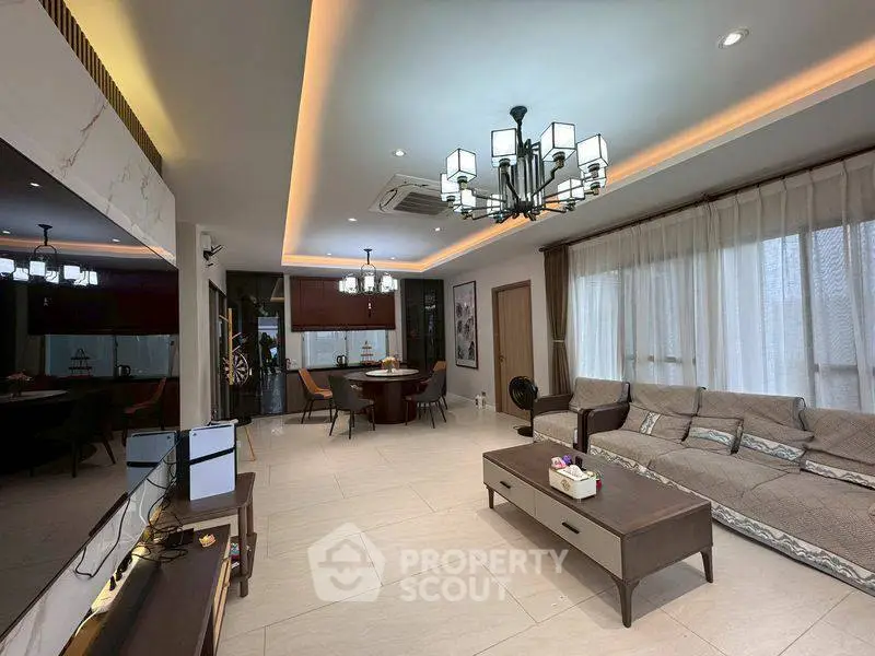 Spacious living room with elegant lighting and modern decor