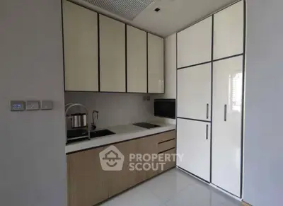 Modern kitchen with sleek cabinetry and built-in appliances