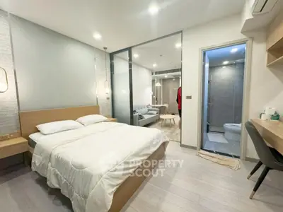 Modern studio apartment with cozy bedroom and stylish living area