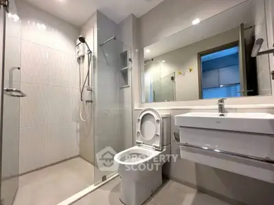 Modern bathroom with glass shower and sleek fixtures