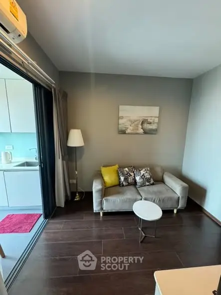 Cozy living room with modern decor and open kitchen view