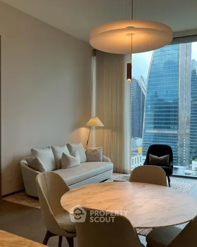 Modern living room with city view, elegant furniture, and stylish lighting.