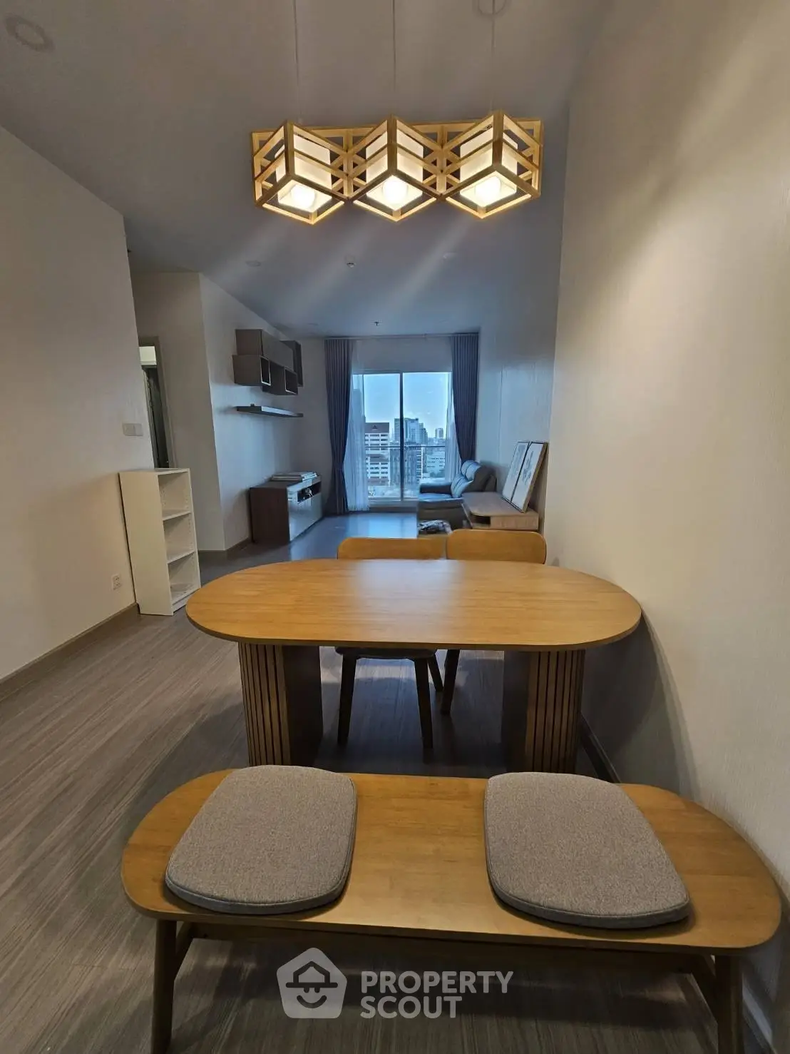 Modern living room with stylish wooden furniture and city view