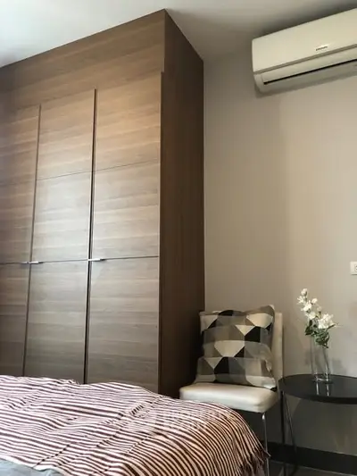 Cozy bedroom with modern air conditioning and stylish decor