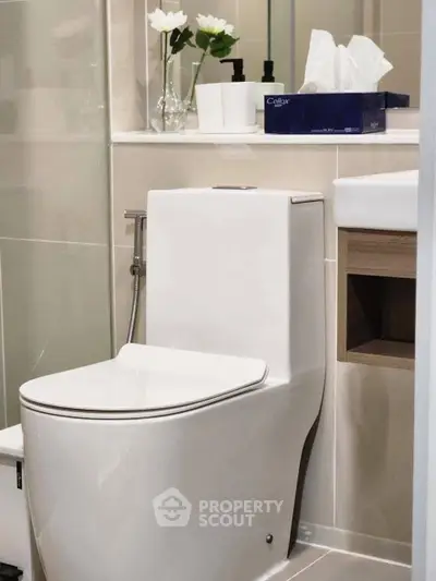 Modern bathroom with sleek toilet and elegant decor