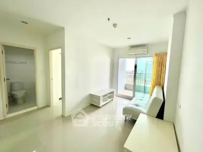 Bright living room with balcony access in modern apartment