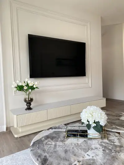 Elegant living room with modern TV setup and stylish decor