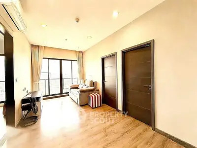 Spacious modern living room with large windows and stylish decor