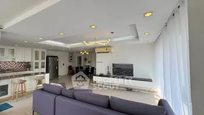 Spacious modern living room with open kitchen and stylish decor
