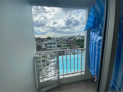 Charming balcony with city view, perfect for relaxation and enjoying the skyline.