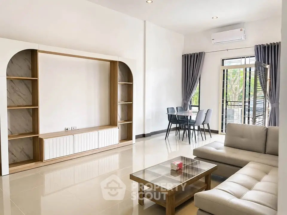 Spacious modern living room with elegant furniture and natural light