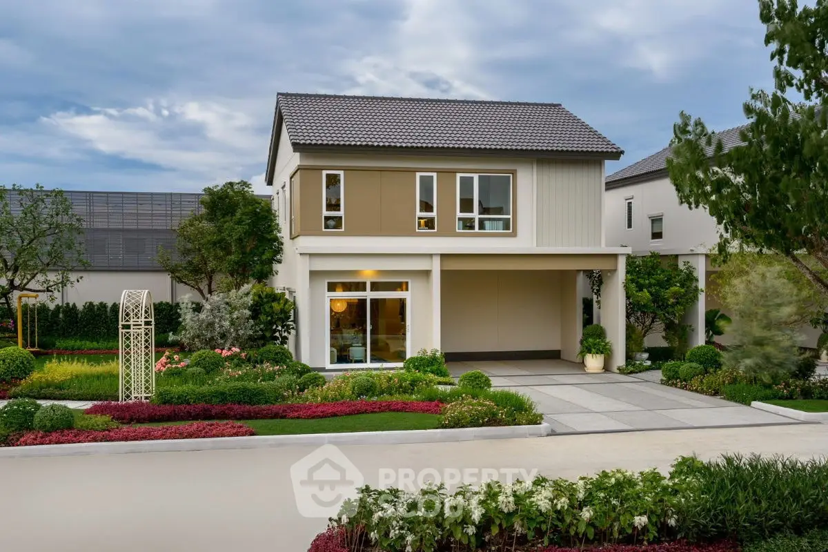 Charming modern two-story house with landscaped garden and spacious driveway.