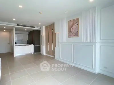 Spacious modern living room with elegant decor and open kitchen layout