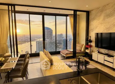 Luxurious living room with stunning city and river view, modern decor, and floor-to-ceiling windows.