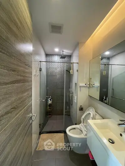 Modern bathroom with glass shower and sleek fixtures