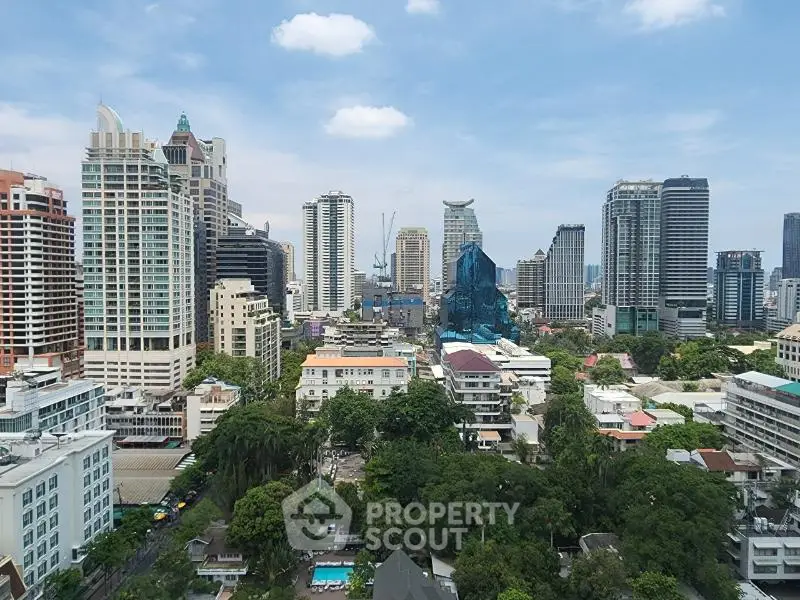 Stunning cityscape view showcasing modern skyscrapers and lush greenery, perfect for urban living enthusiasts.