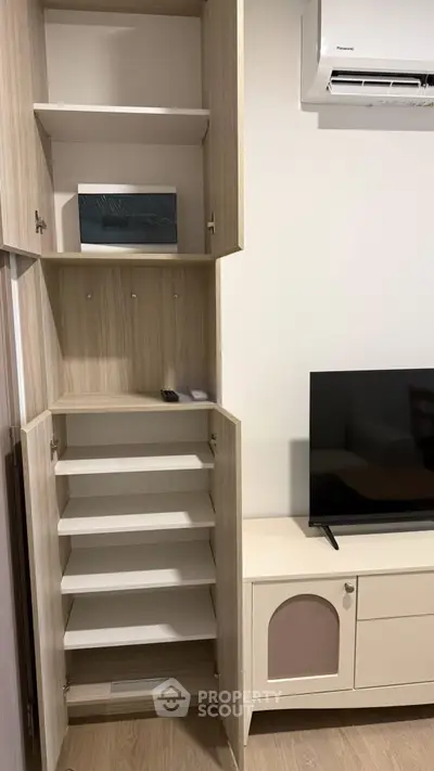 Modern living room with built-in storage and sleek TV setup