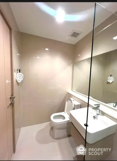 Modern bathroom with sleek design and large mirror