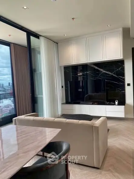 Luxurious modern living room with marble accents and city view, perfect for urban living.
