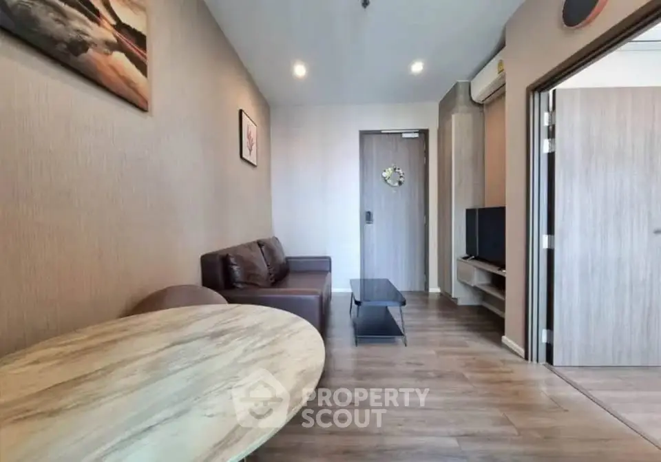 Modern living room with stylish decor and wooden flooring