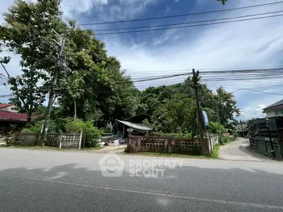 Charming suburban property with lush greenery and potential for development.