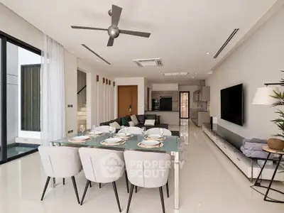 Luxurious open-plan living and dining area with modern decor and sleek finishes.