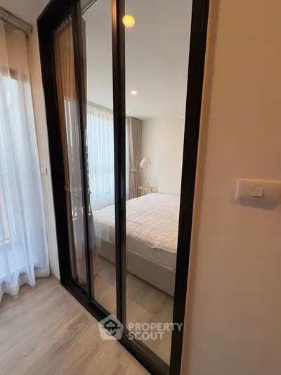 Modern bedroom with sliding glass doors and cozy decor