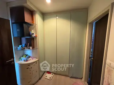 Compact storage area with modern shelving and cabinets in a cozy home setting.