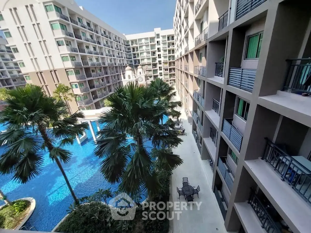 Luxurious condominium with stunning pool view and modern architecture, perfect for urban living.