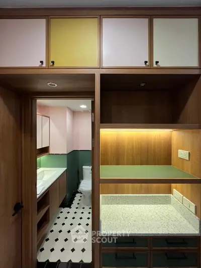 Stylish modern bathroom with elegant cabinetry and unique tile flooring