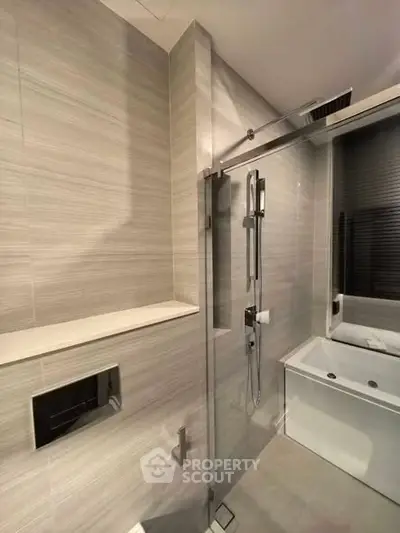 Modern bathroom with sleek shower and bathtub design