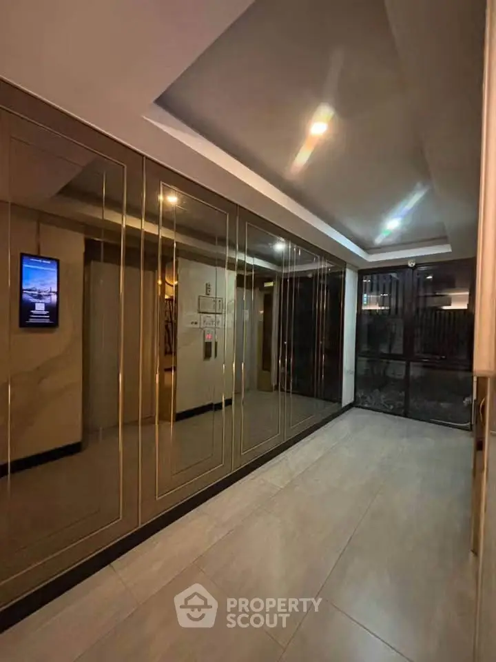 Elegant building entrance with modern lighting and sleek design