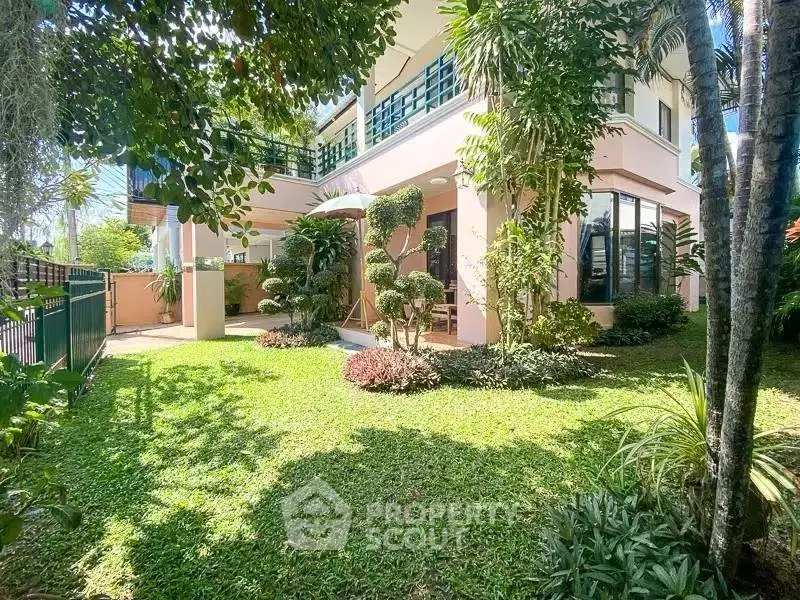 Charming two-story house with lush garden and modern architecture