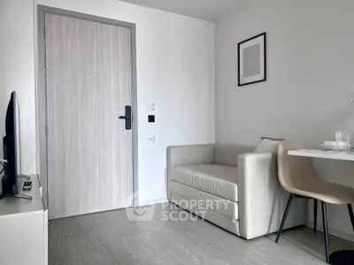 Modern minimalist living room with sleek furniture and neutral tones, perfect for cozy urban living.