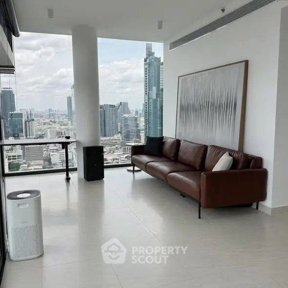 Modern living room with stunning city view and sleek leather sofa