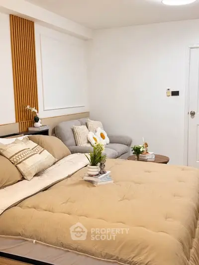 Cozy bedroom with stylish decor and comfortable seating area