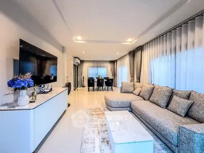 Luxurious modern living room with elegant decor and spacious seating area