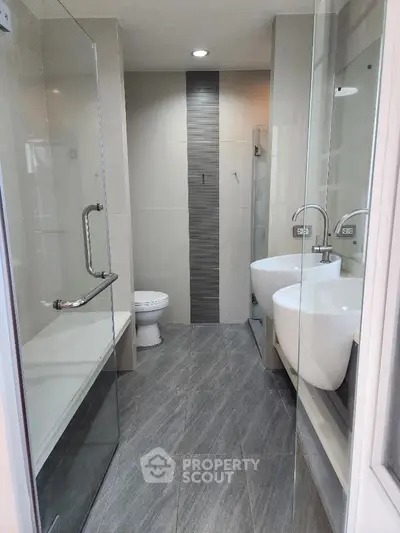 Modern bathroom with sleek design and glass shower enclosure