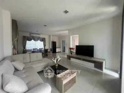 Spacious modern living room with elegant decor and natural light