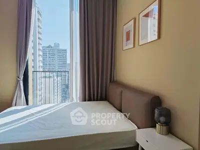 Modern bedroom with city view and stylish decor in high-rise apartment