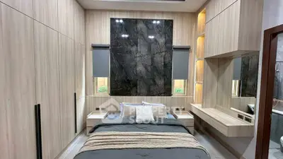 Modern bedroom with sleek wooden paneling and stylish decor